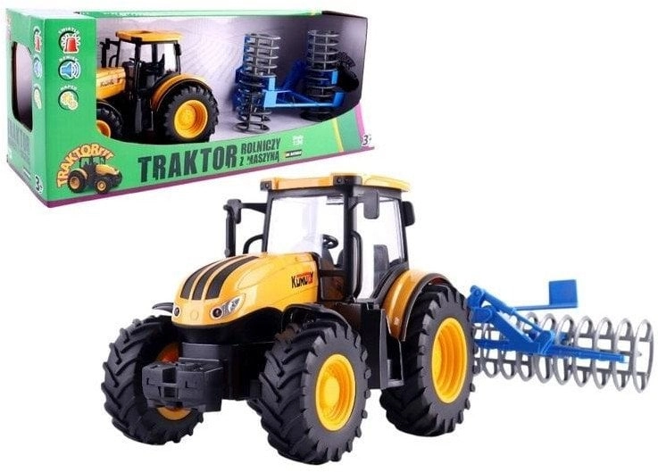 Agricultural tractor with a disc harrow
