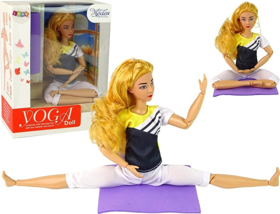 Children`s doll with a yoga mat