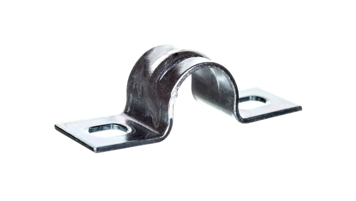 Metal holder for pipes and cables